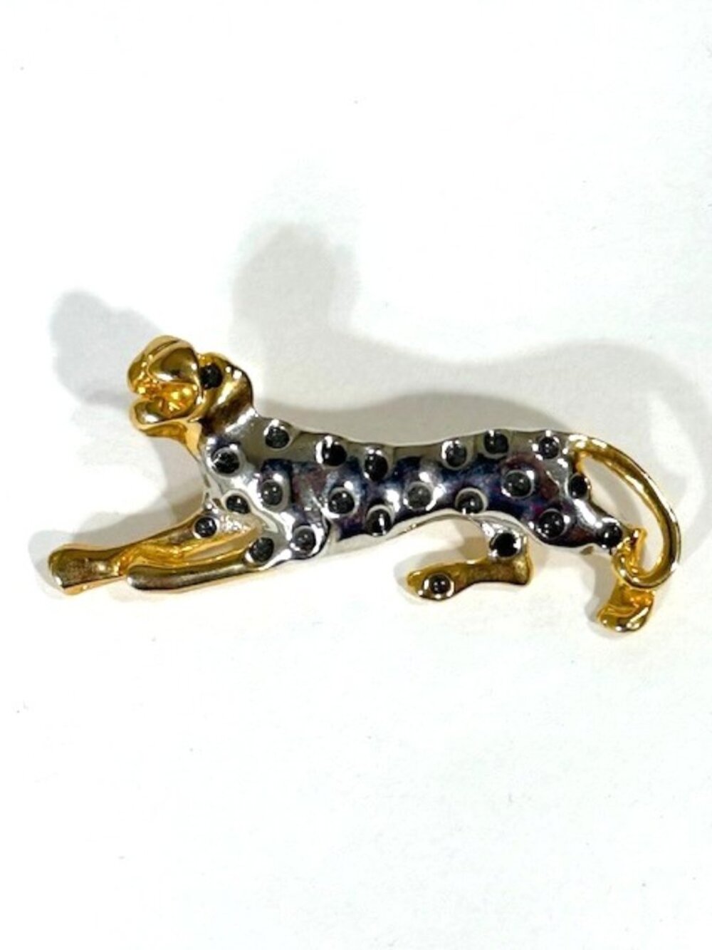 Gold-tone and silver-tone spotted cheetah/leopard/jaguar brooch/pin.